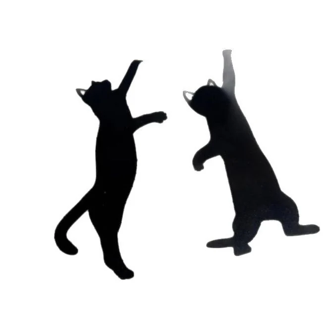 Two black cat silhouette bookmarks reaching up