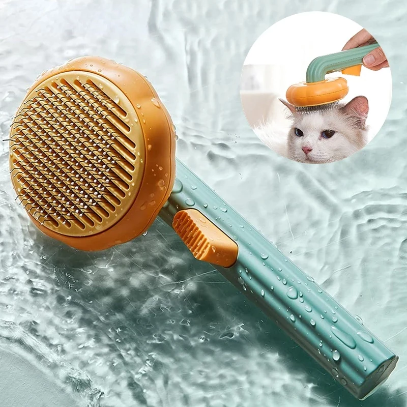 The Easy Groom self-cleaning cat brush with its pumpkin head and release button