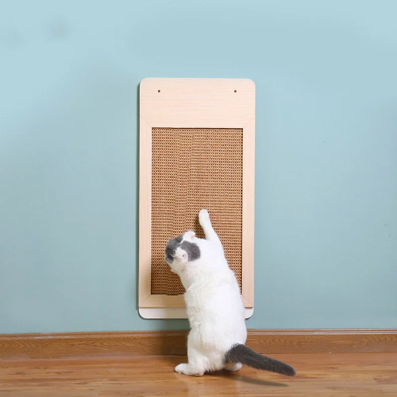 Kitten scratching the wall-mounted sisal scratching panel